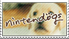 Stamp gif flashing between the nintendogs logo on top of an image of a golden labrador puppy,three nintendogs miniature dachshund puppies, and a nintendogs shiba inu puppy with calico kitten